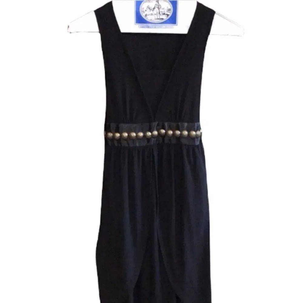 Black v neck dress with grommet details